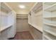 Large walk-in closet with ample shelving and hanging space at 19051 N Aztec Point Dr, Surprise, AZ 85387