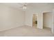 Bright bedroom with ceiling fan and access to bathroom at 19051 N Aztec Point Dr, Surprise, AZ 85387
