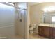 Clean bathroom with shower, toilet and wood vanity at 19051 N Aztec Point Dr, Surprise, AZ 85387