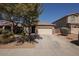 Charming single-story house with stone accents and a two-car garage at 4536 W Rolling Rock Dr, Phoenix, AZ 85086