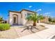 Modern home exterior with a two-car garage and desert landscaping at 36169 N Serrano Ave, Queen Creek, AZ 85140