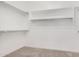 Large walk-in closet with ample shelving and hanging space at 36169 N Serrano Ave, Queen Creek, AZ 85140