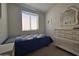 Cozy bedroom featuring a dresser and twin bed at 8700 E University Dr # 1322, Mesa, AZ 85207