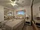 Main bedroom with a double bed, nightstands, and mirrored closet doors at 8700 E University Dr # 1322, Mesa, AZ 85207