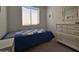 Small bedroom with twin bed, dresser, and window at 8700 E University Dr # 1322, Mesa, AZ 85207