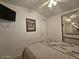 Bedroom with double bed, wall-mounted TV and mirrored closet at 8700 E University Dr # 1322, Mesa, AZ 85207