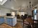 Open concept kitchen and living room with island and seating at 8700 E University Dr # 1322, Mesa, AZ 85207