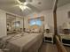 Well-lit bedroom with a double bed and mirrored closet doors at 8700 E University Dr # 1322, Mesa, AZ 85207