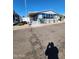 Blue manufactured home with covered porch and steps at 11596 W Sierra Dawn Blvd # 128, Surprise, AZ 85378