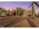 Stunning desert home with stucco exterior, large windows, and a gravel driveway at 31527 N 174Th St, Rio Verde, AZ 85263