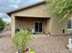 Covered patio with seating area, offering a relaxing outdoor space at 148 S 225Th Ln, Buckeye, AZ 85326
