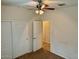 Well-lit bedroom with a closet and access to a bathroom at 148 S 225Th Ln, Buckeye, AZ 85326