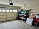 Organized garage with overhead storage and ample space at 148 S 225Th Ln, Buckeye, AZ 85326