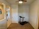 Room with treadmill and closet, ideal as an office or gym at 148 S 225Th Ln, Buckeye, AZ 85326
