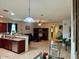 Open living room with kitchen island and dining area at 148 S 225Th Ln, Buckeye, AZ 85326