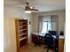 Home office space with a desk, chair, and bookcase at 148 S 225Th Ln, Buckeye, AZ 85326