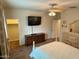 Spacious bedroom with a walk-in closet and mounted TV at 148 S 225Th Ln, Buckeye, AZ 85326