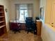 Home office with built-in shelving and two workstations at 148 S 225Th Ln, Buckeye, AZ 85326