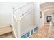 Inviting entryway with staircase, built-in bench, and tile flooring at 35202 N 30Th Dr, Phoenix, AZ 85086
