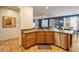 Kitchen island with seating and stainless steel dishwasher at 35202 N 30Th Dr, Phoenix, AZ 85086