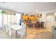 Bright kitchen boasts an island, wood cabinetry, and a breakfast nook at 35202 N 30Th Dr, Phoenix, AZ 85086