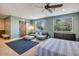 Main bedroom with sitting area, large windows, and a barn door at 35202 N 30Th Dr, Phoenix, AZ 85086