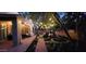 Night view of a backyard with string lights and lush landscaping at 35202 N 30Th Dr, Phoenix, AZ 85086
