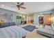 Bright main bedroom with walk-in closet and sitting area at 35202 N 30Th Dr, Phoenix, AZ 85086