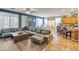Open living area includes sectional sofa, kitchen views, and adjacent dining area at 35202 N 30Th Dr, Phoenix, AZ 85086