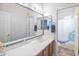 Bathroom with double vanity, mirror, and shower/tub combo at 35202 N 30Th Dr, Phoenix, AZ 85086