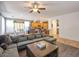 Spacious living room with sectional sofa and view into kitchen at 35202 N 30Th Dr, Phoenix, AZ 85086