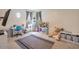 Bedroom with a large rug, desk and plush toys at 35202 N 30Th Dr, Phoenix, AZ 85086