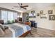 Spacious main bedroom with a king-size bed and large TV at 35202 N 30Th Dr, Phoenix, AZ 85086