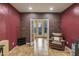 Home office with access to backyard and brick accent wall at 35202 N 30Th Dr, Phoenix, AZ 85086