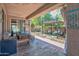 Covered patio, fire pit, and lush landscaping at 35202 N 30Th Dr, Phoenix, AZ 85086