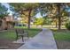 Landscaped walkway with benches in a community setting at 3491 N Arizona Ave # 138, Chandler, AZ 85225