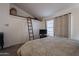 Bedroom with king-size bed and built-in loft storage at 3491 N Arizona Ave # 138, Chandler, AZ 85225