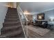 Carpeted staircase leading to the upper level of the home at 3491 N Arizona Ave # 138, Chandler, AZ 85225