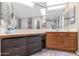 Bathroom with double vanity and walk-in shower at 17404 N 99Th Ave # 108, Sun City, AZ 85373