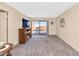 Living room with fireplace, sliding door to patio, and carpet at 17404 N 99Th Ave # 108, Sun City, AZ 85373