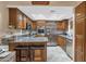 Kitchen features stainless steel appliances and wood cabinets at 17404 N 99Th Ave # 108, Sun City, AZ 85373