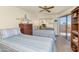 Guest bedroom with twin beds and patio access at 17404 N 99Th Ave # 108, Sun City, AZ 85373