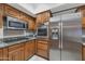 Modern kitchen with stainless steel appliances and granite countertops at 17404 N 99Th Ave # 108, Sun City, AZ 85373