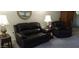 Relaxing living room with reclining sofas and end tables at 17404 N 99Th Ave # 108, Sun City, AZ 85373