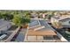 Aerial view of a house with solar panels, a covered patio, and a fenced backyard at 16275 W Buchanan St, Goodyear, AZ 85338