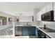 Modern kitchen with dark blue cabinets and quartz countertops at 16275 W Buchanan St, Goodyear, AZ 85338