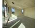 Sunlit living room with sliding doors and ample space at 22857 E Roundup Way, Queen Creek, AZ 85142