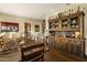 Rustic dining room with large wooden table and hutch at 36389 N 105Th Pl, Scottsdale, AZ 85262