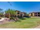 Two-story building with Spanish-style architecture and landscaped grounds at 21320 N 56Th St # 2163, Phoenix, AZ 85054