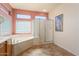 Bathroom with soaking tub and walk-in shower at 19973 N Half Moon Dr, Surprise, AZ 85374